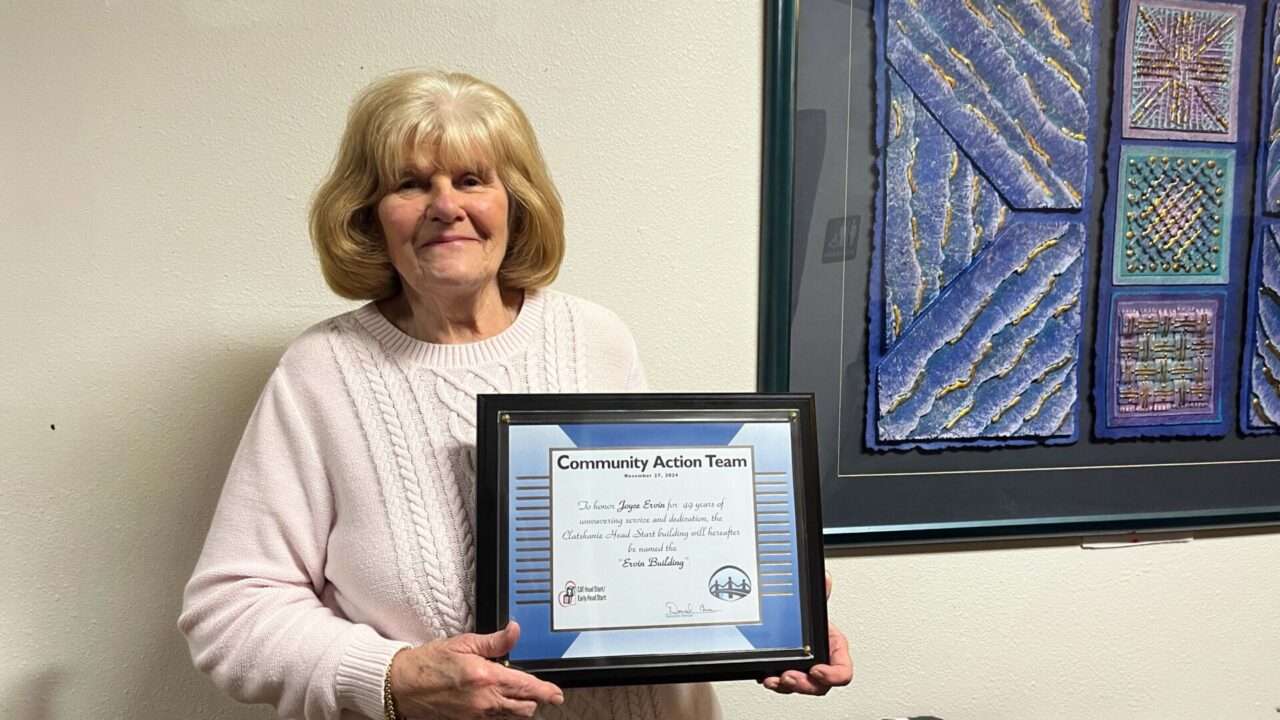 Joyce Irvin retirement photo with certificate of excellence